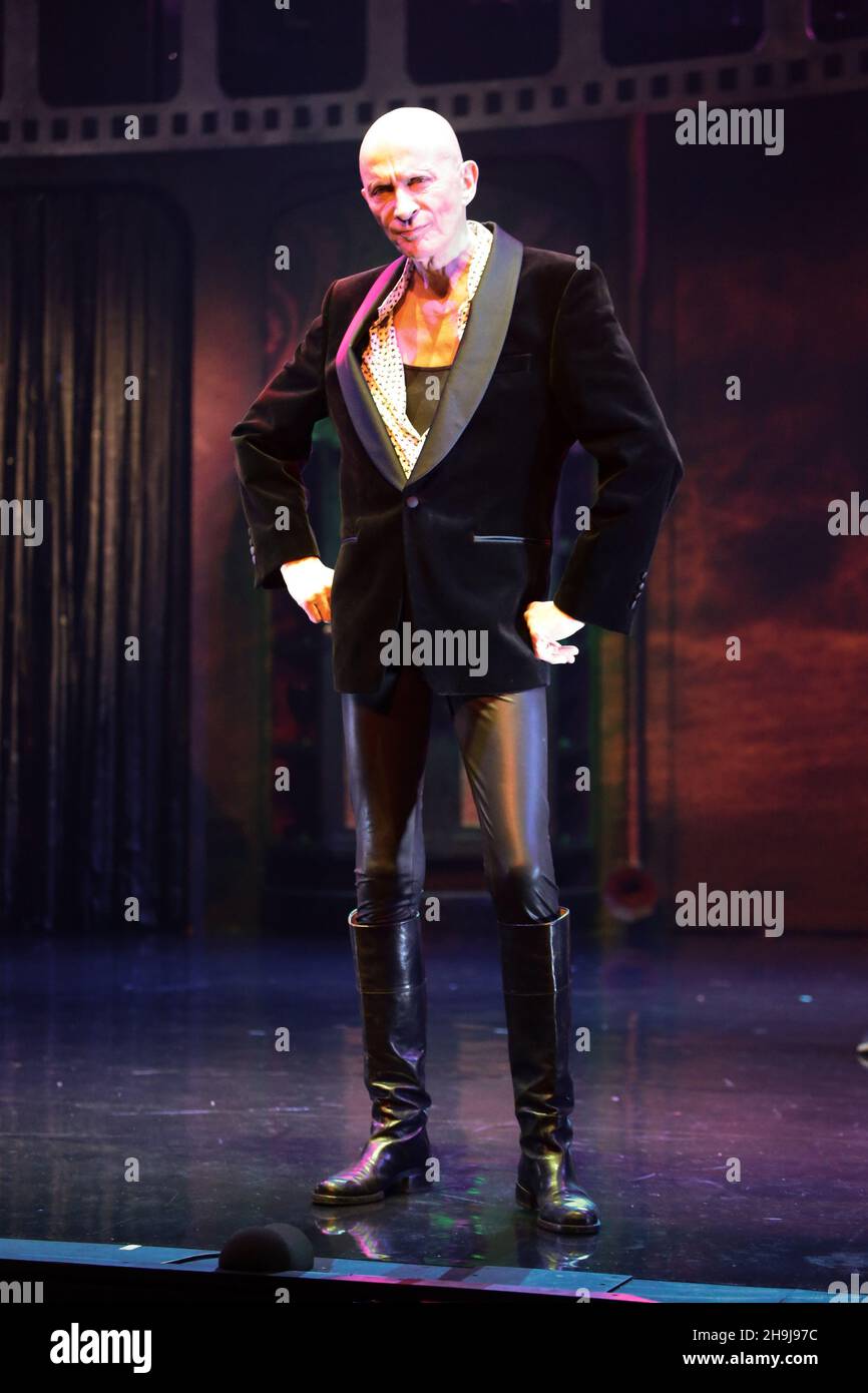 Richard O'Brien (the show's creator) plays the narrator in the Rocky Horror Show performing on stage at a press call at the Playhouse Theatre in London's West End Stock Photo