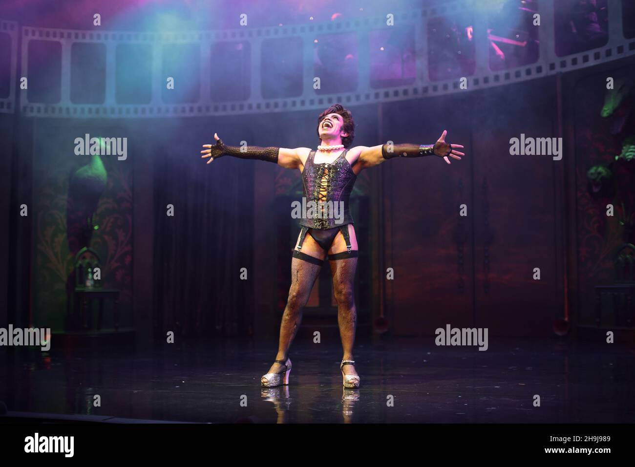 David Bedella in the Rocky Horror Show performing on stage at a press call at the Playhouse Theatre in London's West End Stock Photo