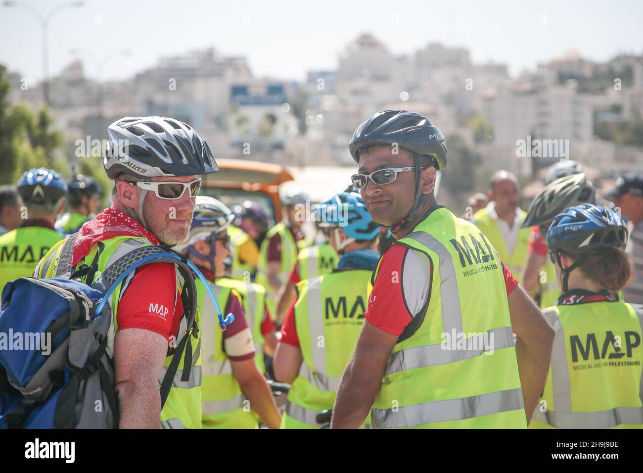 Ben Cosh (left) and Jatinder Sanghera take a rest before entering Hebron in Palestine. General views of a fundraiser cycling trip around the West Bank of Palestine organised by British charity Medical Aid for Palestinians in 2015 Stock Photo
