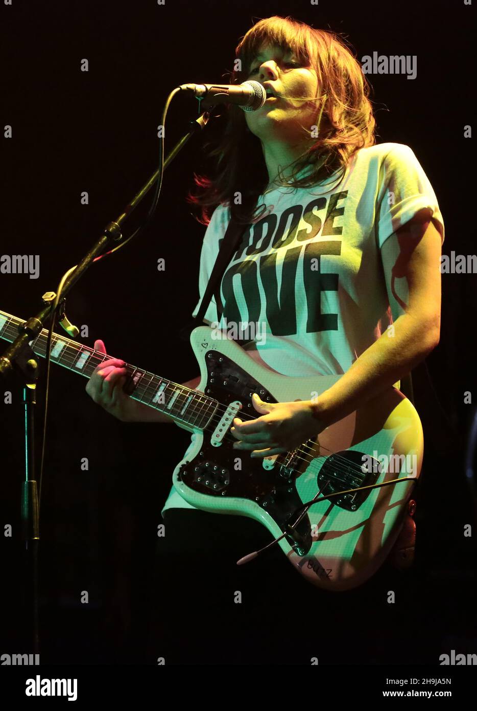 Courtney and her band performing live on stage at The O2 Forum