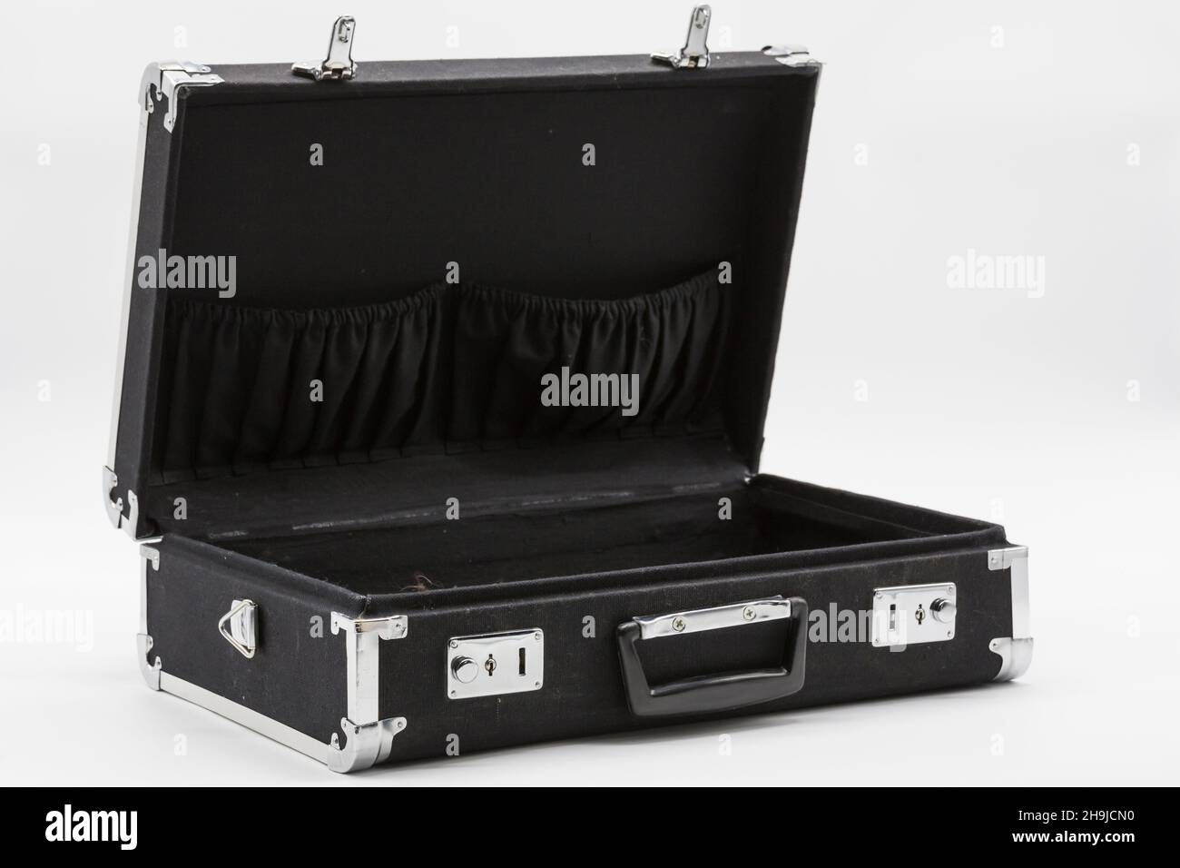 Retro, open black briefcase, open on a white background Stock Photo - Alamy