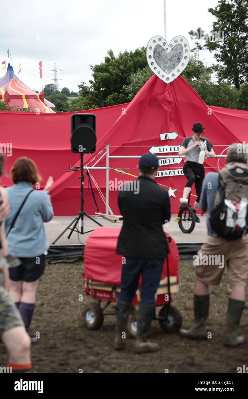 A unicyclist performing on stage at the Glastonbury 2016 Festival on