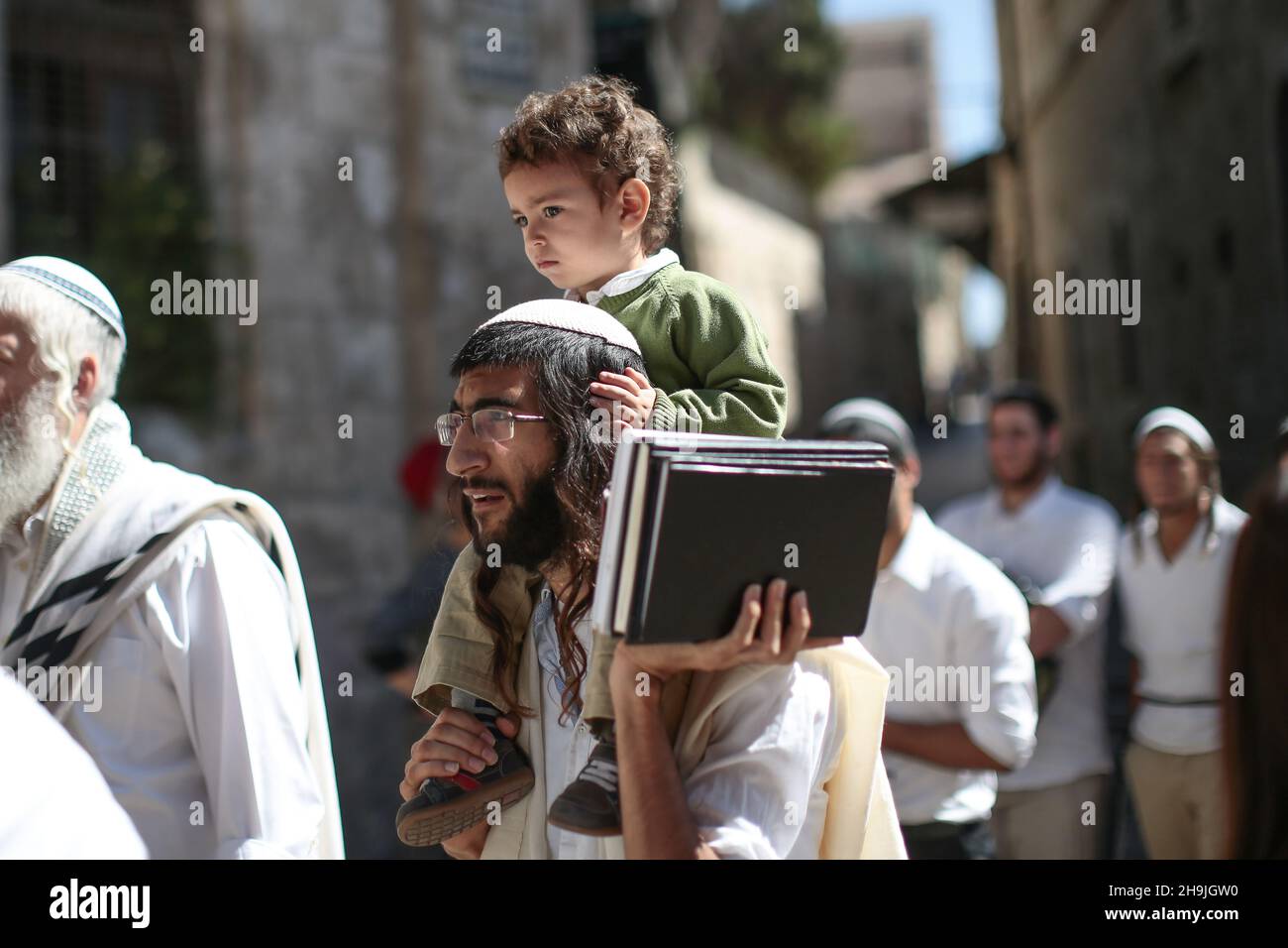 A Jewish settler with a child on his shoulders in East Jerusalem. From a series of photos commissioned by  British NGO, Medical Aid for Palestinians (MAP). Photo credit should read: Richard Gray/Empics Entertainment Stock Photo