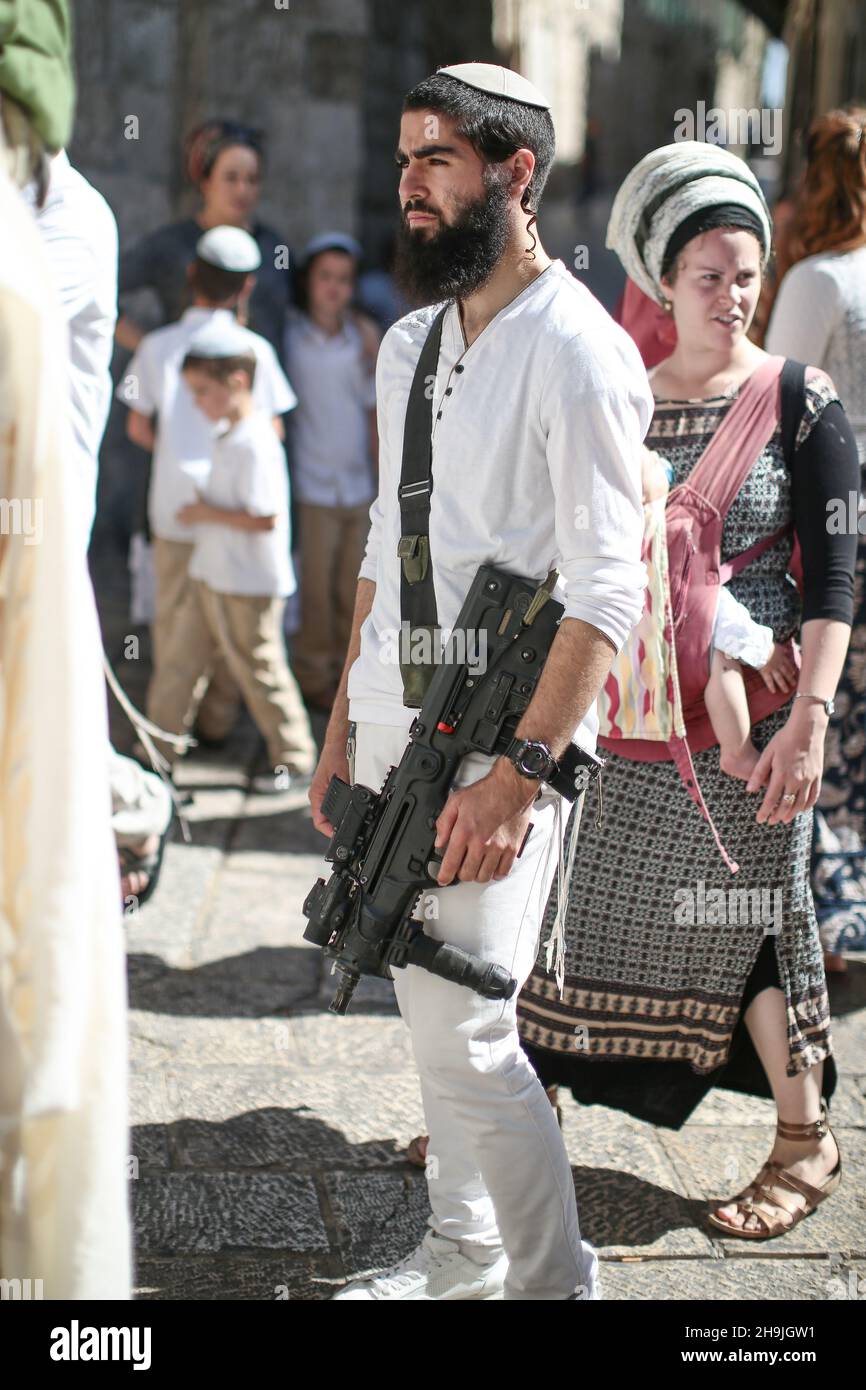 A Jewish settler with a machine gun in East Jerusalem. From a series of photos commissioned by  British NGO, Medical Aid for Palestinians (MAP). Photo credit should read: Richard Gray/Empics Entertainment Stock Photo
