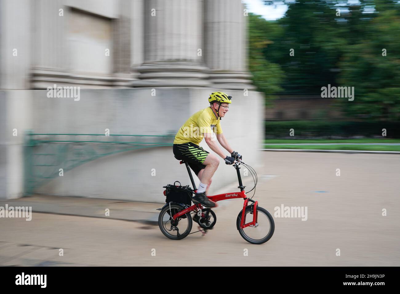 A view of a business man riding a Brompton folding bike near Trafalgar Square in London, UK. Photo date: Thursday, August 3, 2017. Photo credit should read: Richard Gray/EMPICS Entertainment Stock Photo