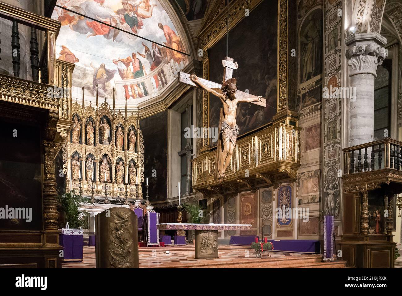 Salò, Italy (4th December 2021) - The altar of the cathedral of Salò with the antique wooden crucifix of the XV century Stock Photo