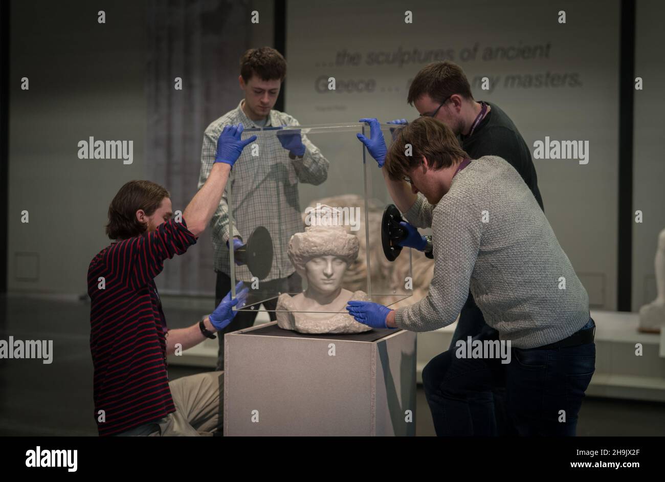 British Museum conservators lift the case onto the sculpture Pallas ...
