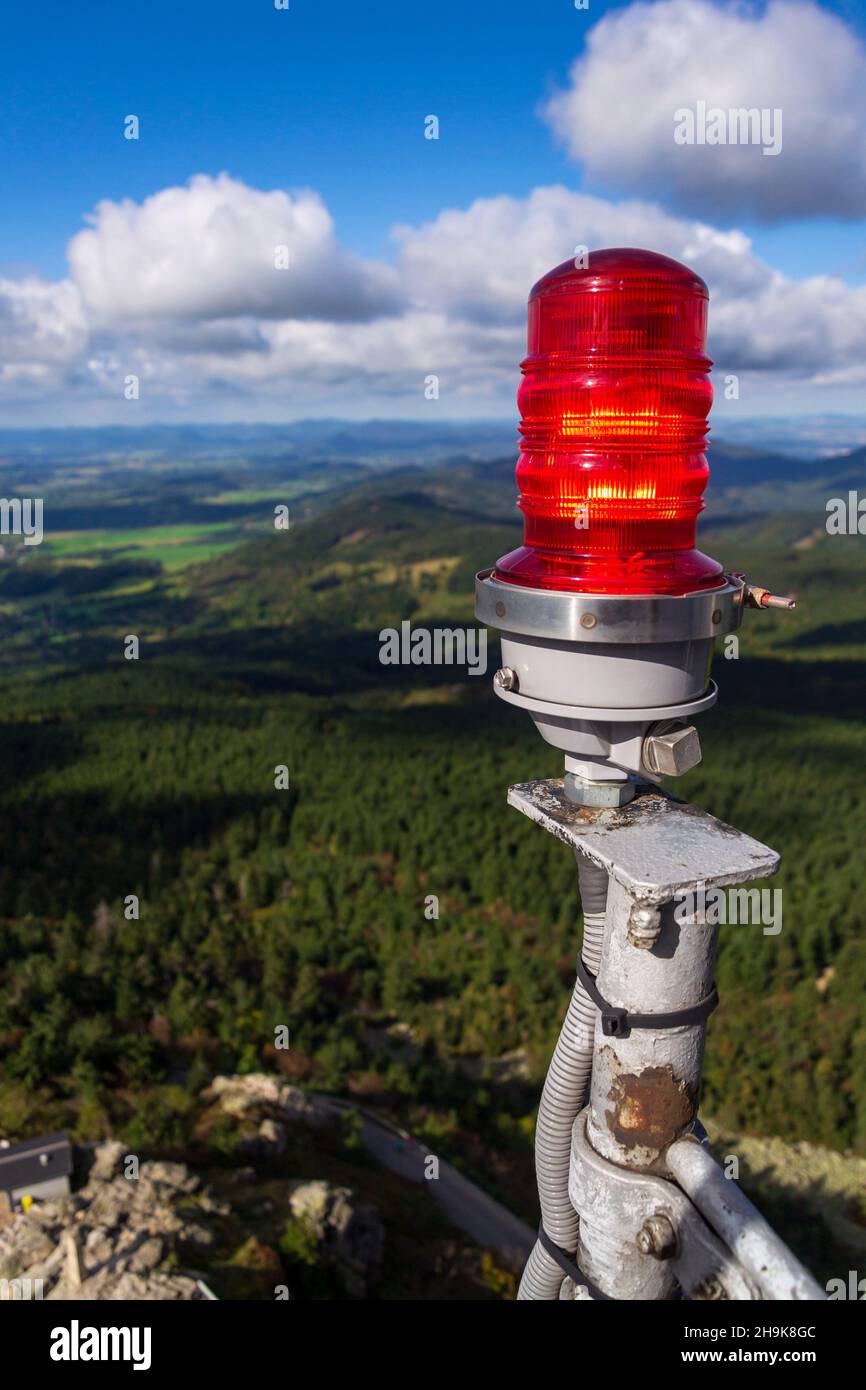 Red warning lights for air traffic on roof of high building, airport lighting equipment, daylight Stock Photo