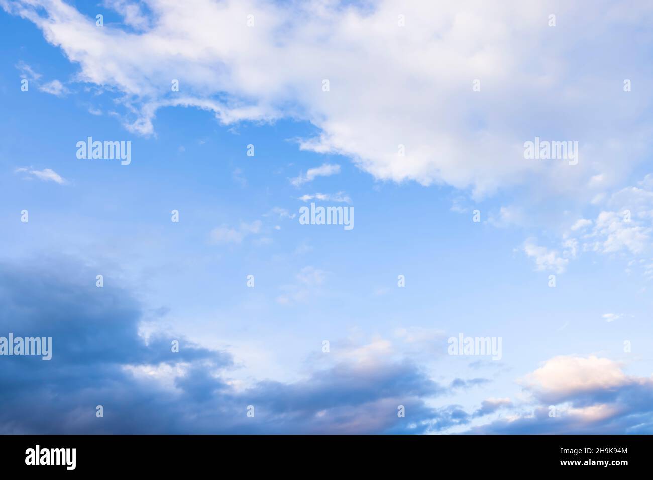 Dramatic storm clouds against a blue sky. Ideal for a climate or environment background Stock Photo
