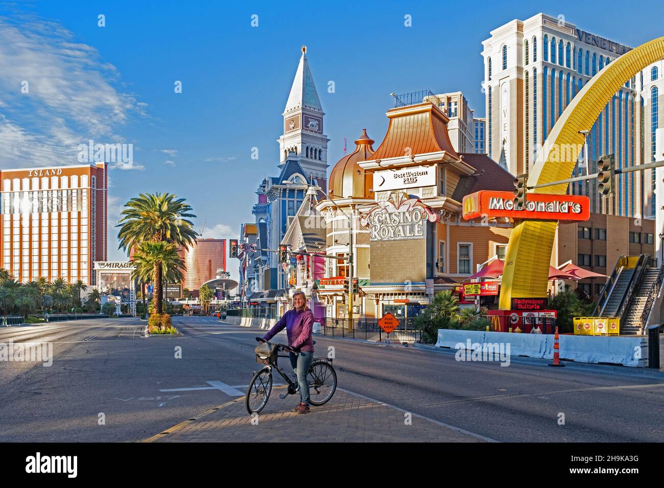 Lonely cyclist on deserted, empty Las Vegas Strip during the COVID-19 pandemic / coronavirus pandemic, Clark County, Nevada, United States, USA Stock Photo