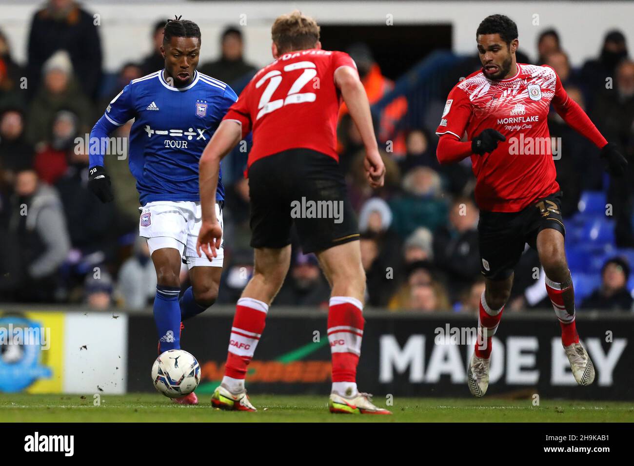 Kyle Edwards of Ipswich Town in action with Mikael Mandron and Billy Sass-Davies of Crewe Alexandra - Ipswich Town v Crewe Alexandra, Sky Bet League One, Portman Road, Ipswich, UK - 28th November 2021  Editorial Use Only - DataCo restrictions apply Stock Photo