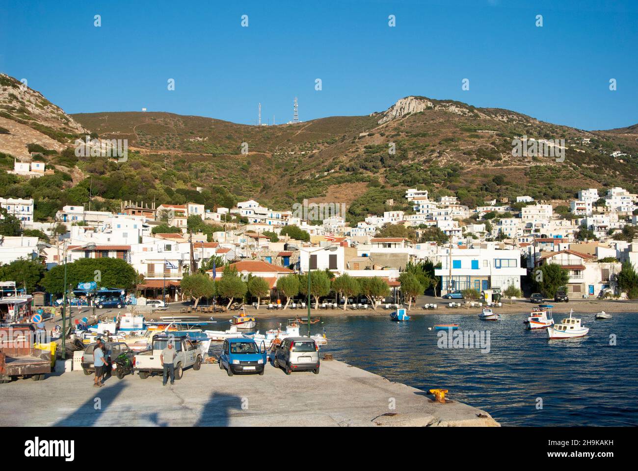 Fourni isle - Greece - September 1 2014 : Beautiful Greek island. Busy harbor and waterfront in a charming bay. Landscape aspect shot.  Copy space. Stock Photo