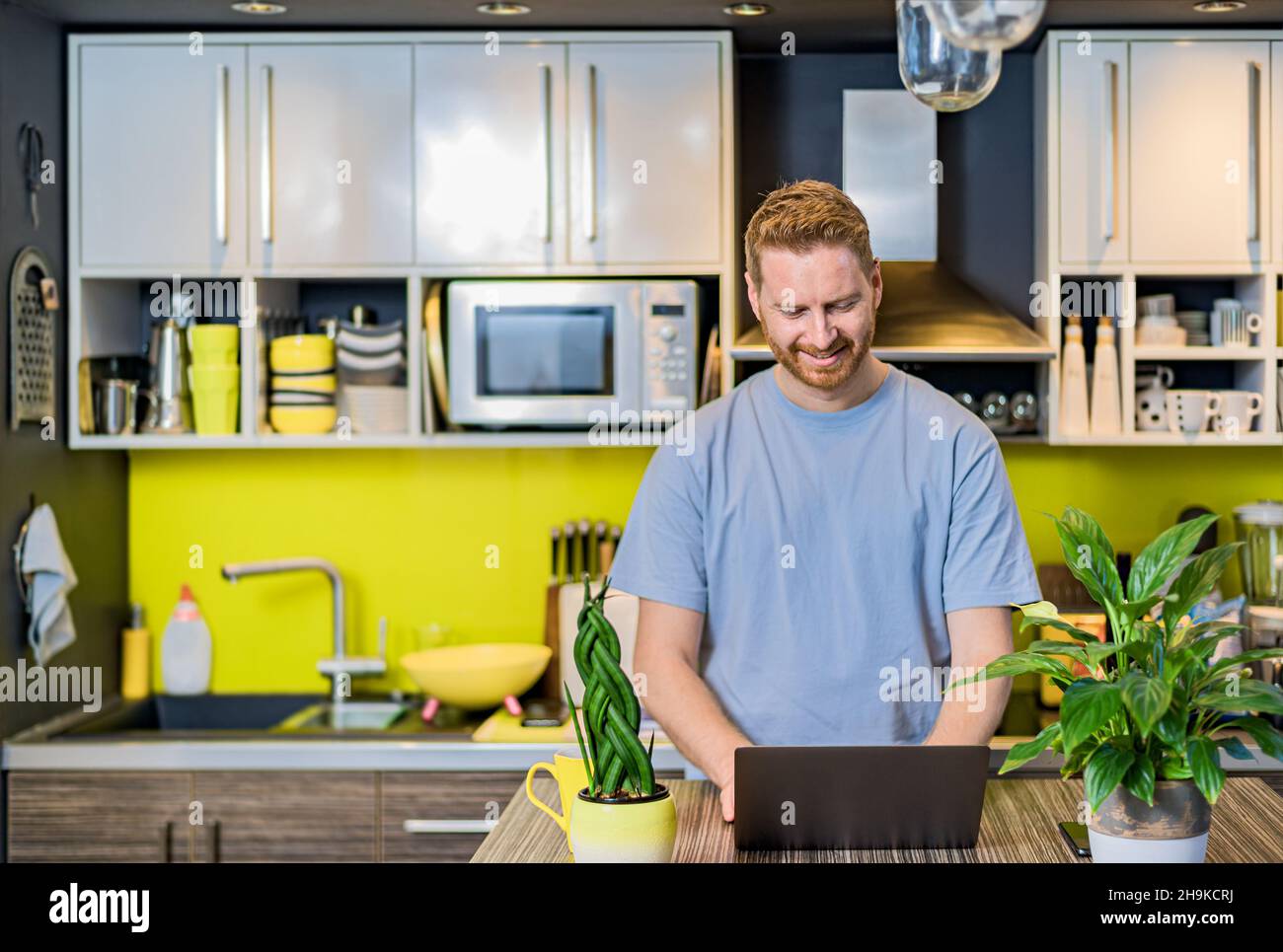 Portrait of a successful young entrepreneur working from home at cozy ...