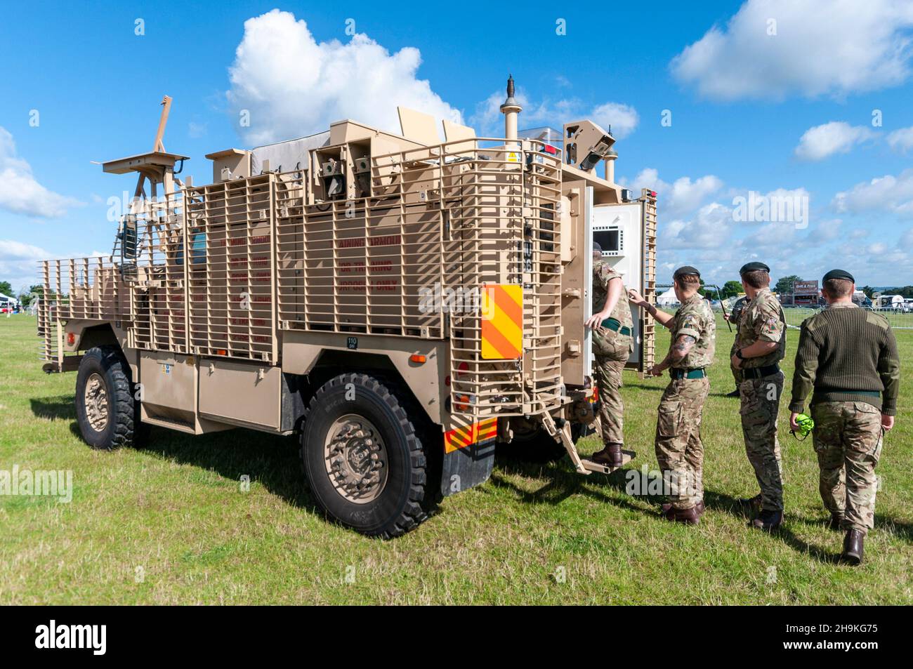 Soldiers board a Ridgback PPV (Protected Patrol Vehicle) on display at armed forces day event at Orsett, Essex, UK. Armoured infantry mobility vehicle Stock Photo