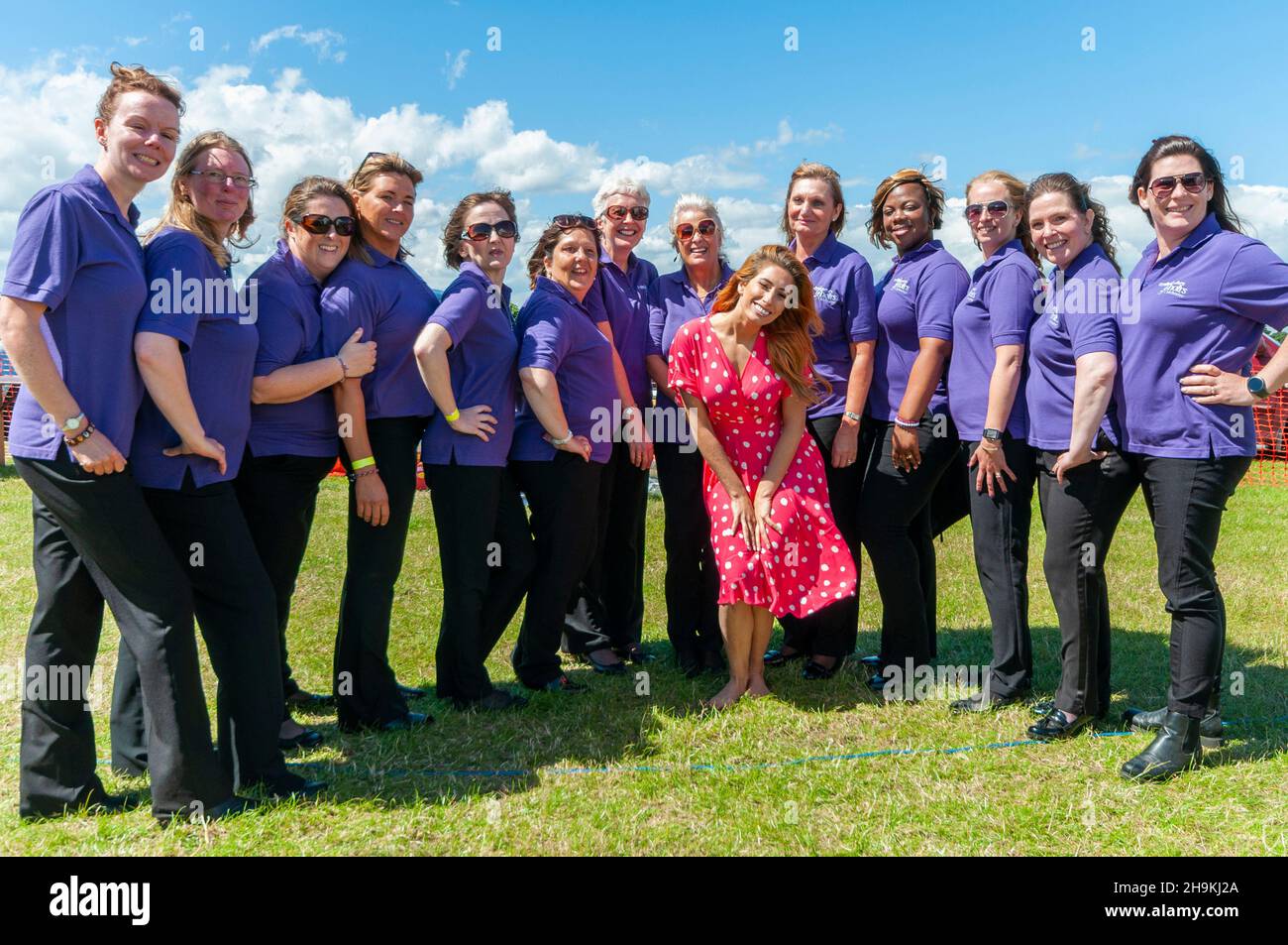 Stacey Solomon and Colchester Military Wives Choir at an Armed Forces Day charity event at Orsett, Essex, UK. Singers Stock Photo