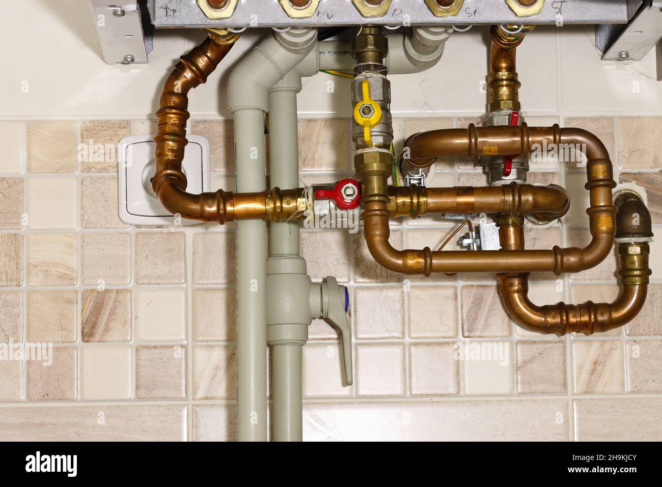 Jungle of pipes at the condensing gas boiler Stock Photo