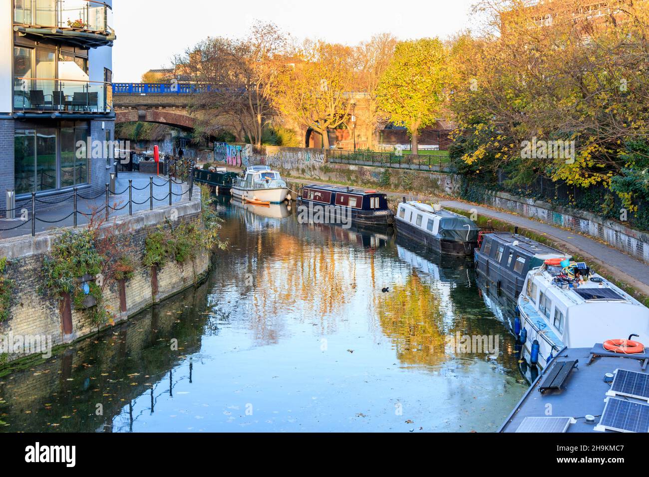 Narrowboats moored in Limehouse Cut, a link between the River Lea and the River Thames at Limehouse, London, UK Stock Photo