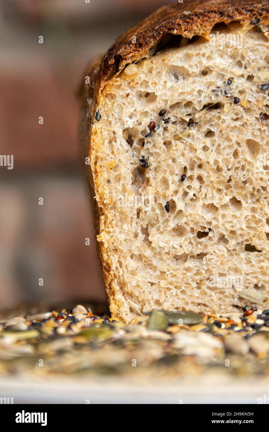 color photograph of natural yeast bread with green seeds Stock Photo