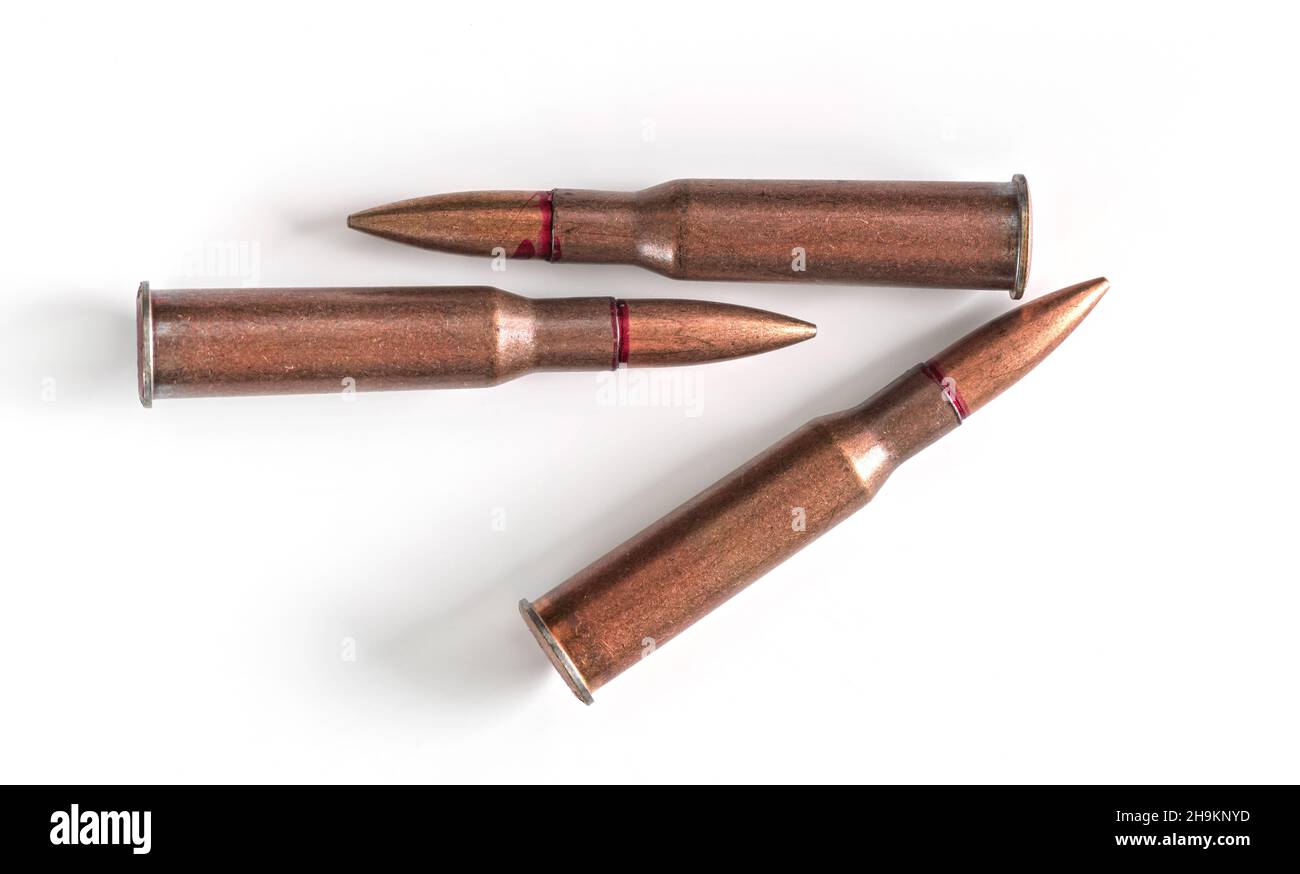 Three copper machine gun bullets isolated on white background Stock Photo