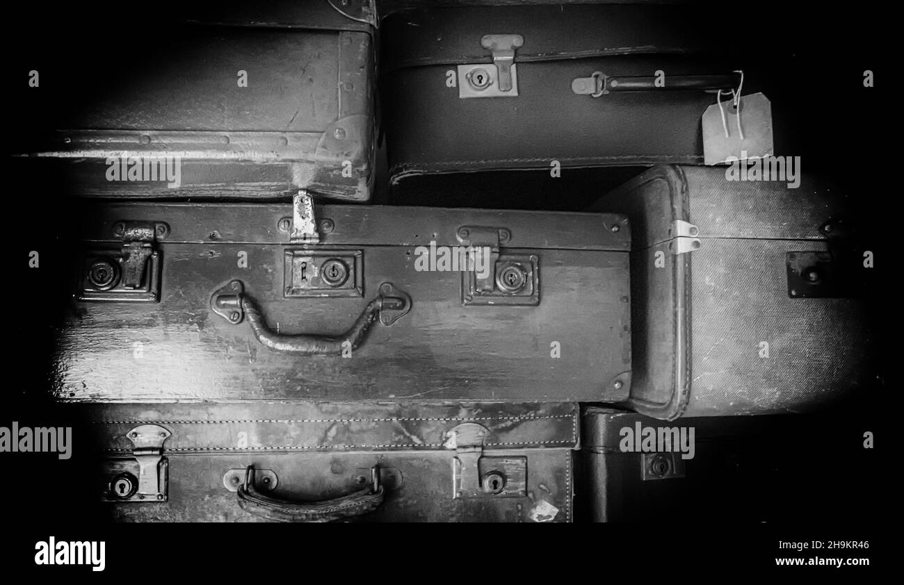 A pile of old abandoned suitcases Stock Photo