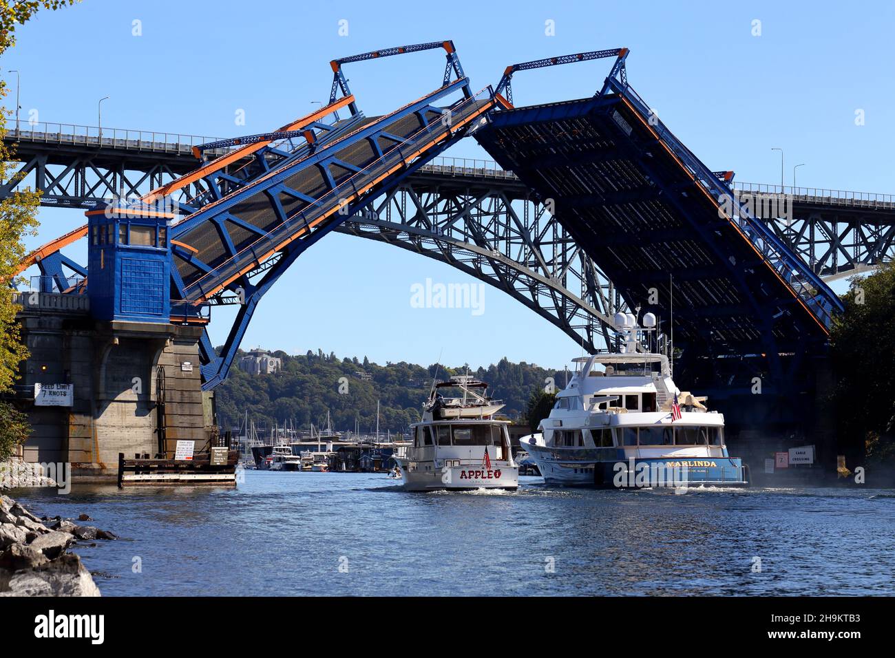 Two boats passing an opened Fremont Bridge, Seattle, Washington. Stock Photo