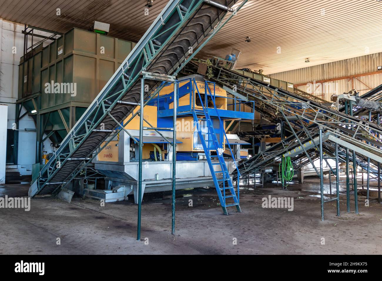Huelva, Spain - December 04,2021: Artisan olive oil processing machinery Stock Photo