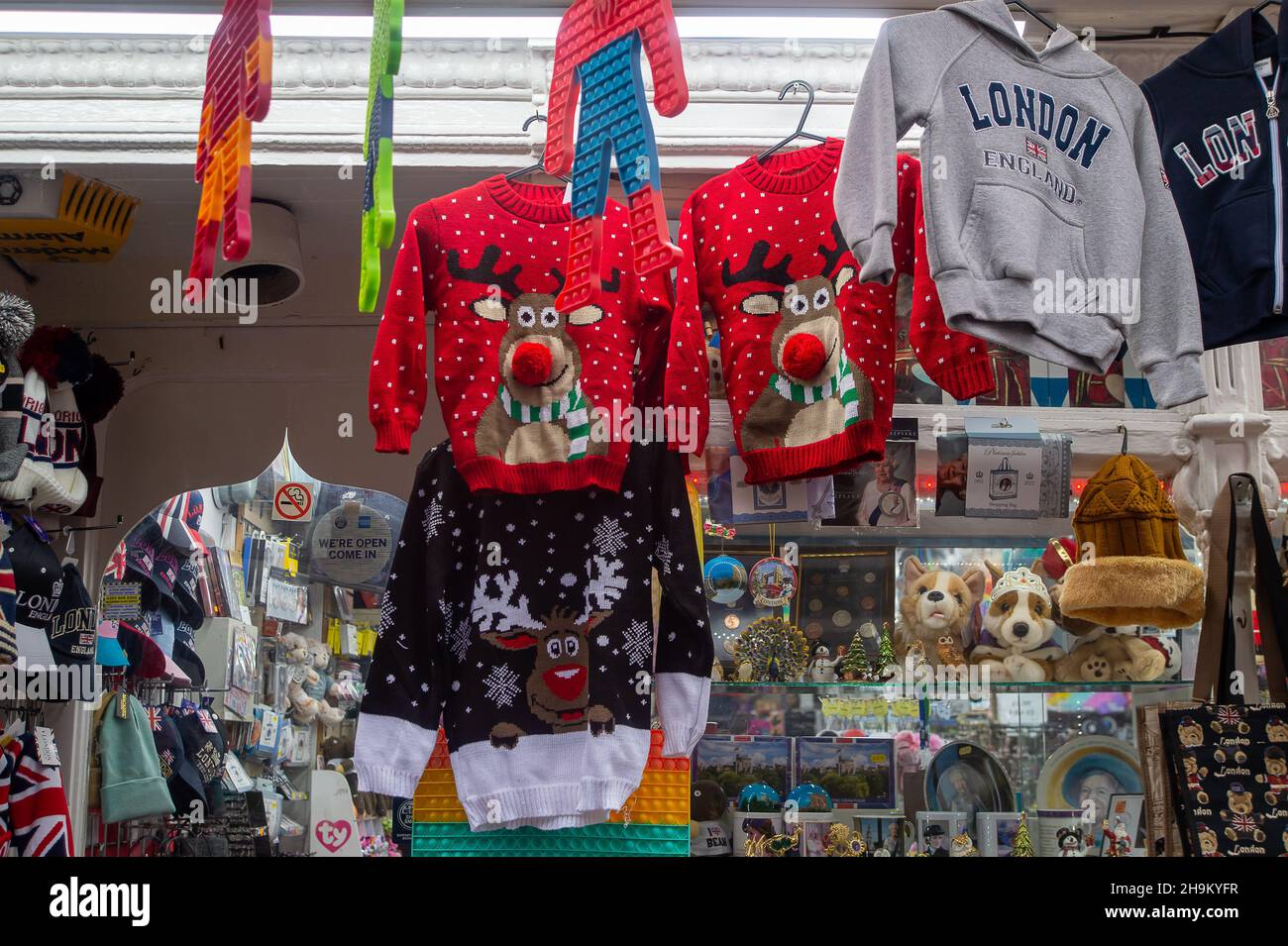 Windsor, Berkshire, UK. 7th December, 2021. Christmas jumpers for sale in a tourist shop in Windsor. As more countries join the Covid-19 red list, less tourists will be arriving in the UK again. Credit: Maureen McLean/Alamy Stock Photo