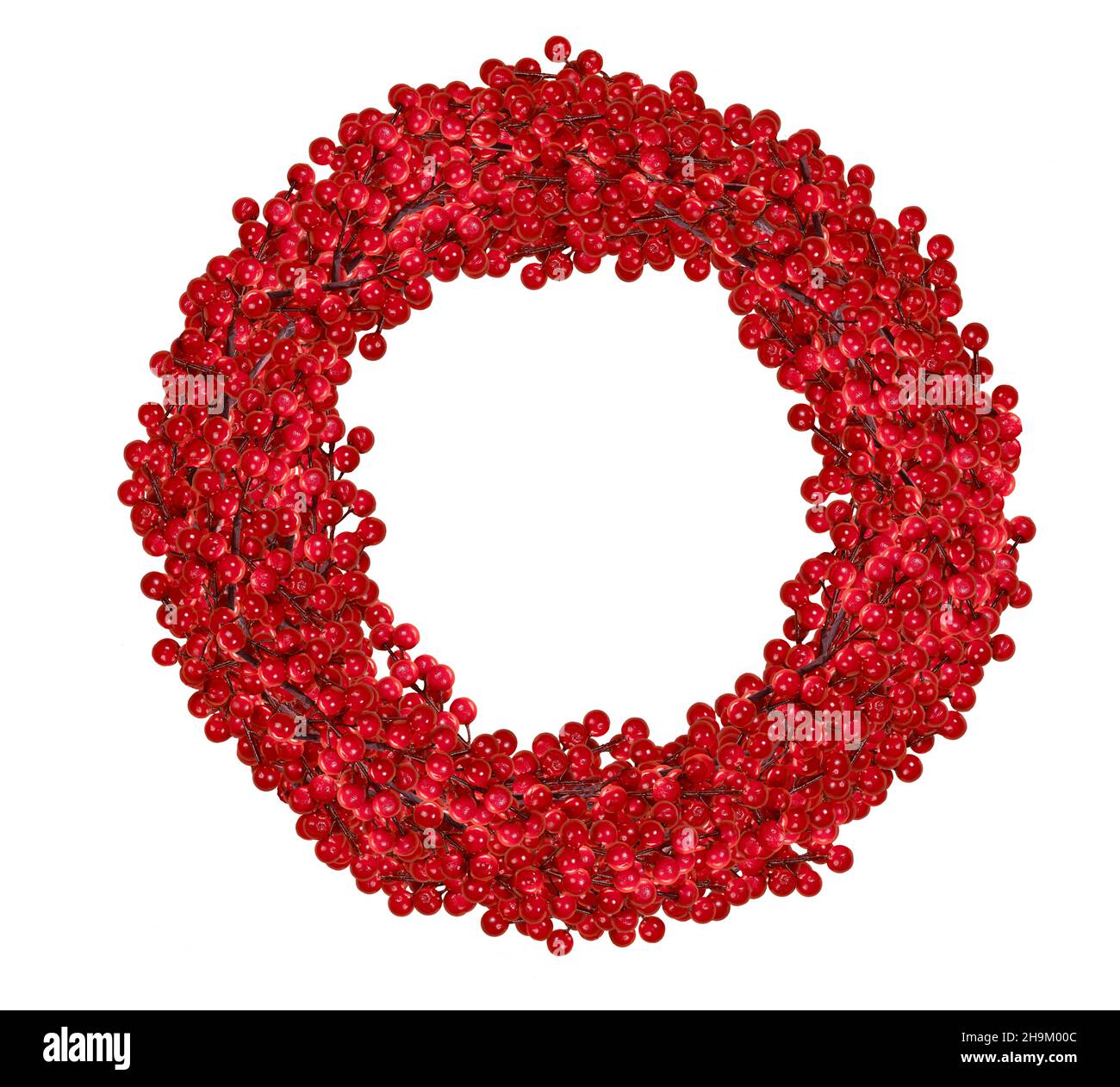 Lush red berry wreath isolated on white background. Christmas holiday decoration. Door ornament. Stock Photo