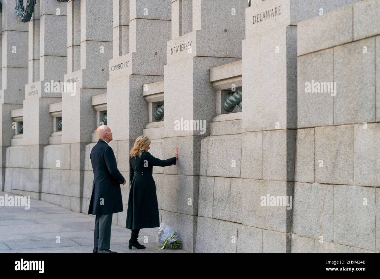 Washington, United States Of America. 07th Dec, 2021. Washington, United States of America. 07 December, 2021. U.S President Joe Biden and First Lady Jill Biden pause to mark the 80th anniversary of the Japanese attack on Pearl Harbor at the World War Two memorial, December 7, 2021 in Washington, DC Credit: Adam Schultz/White House Photo/Alamy Live News Stock Photo