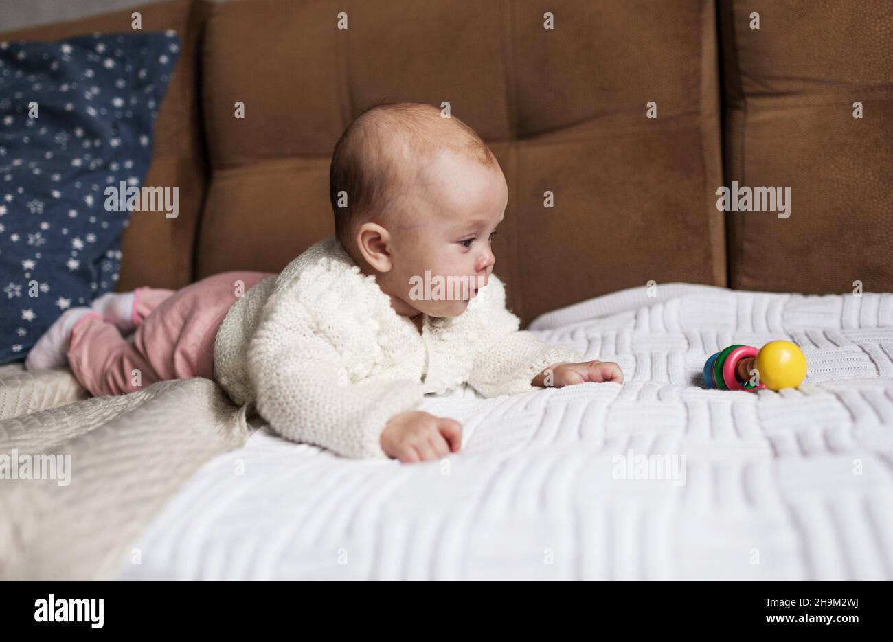 a newborn baby in a crib, the concept of children and the birth Stock