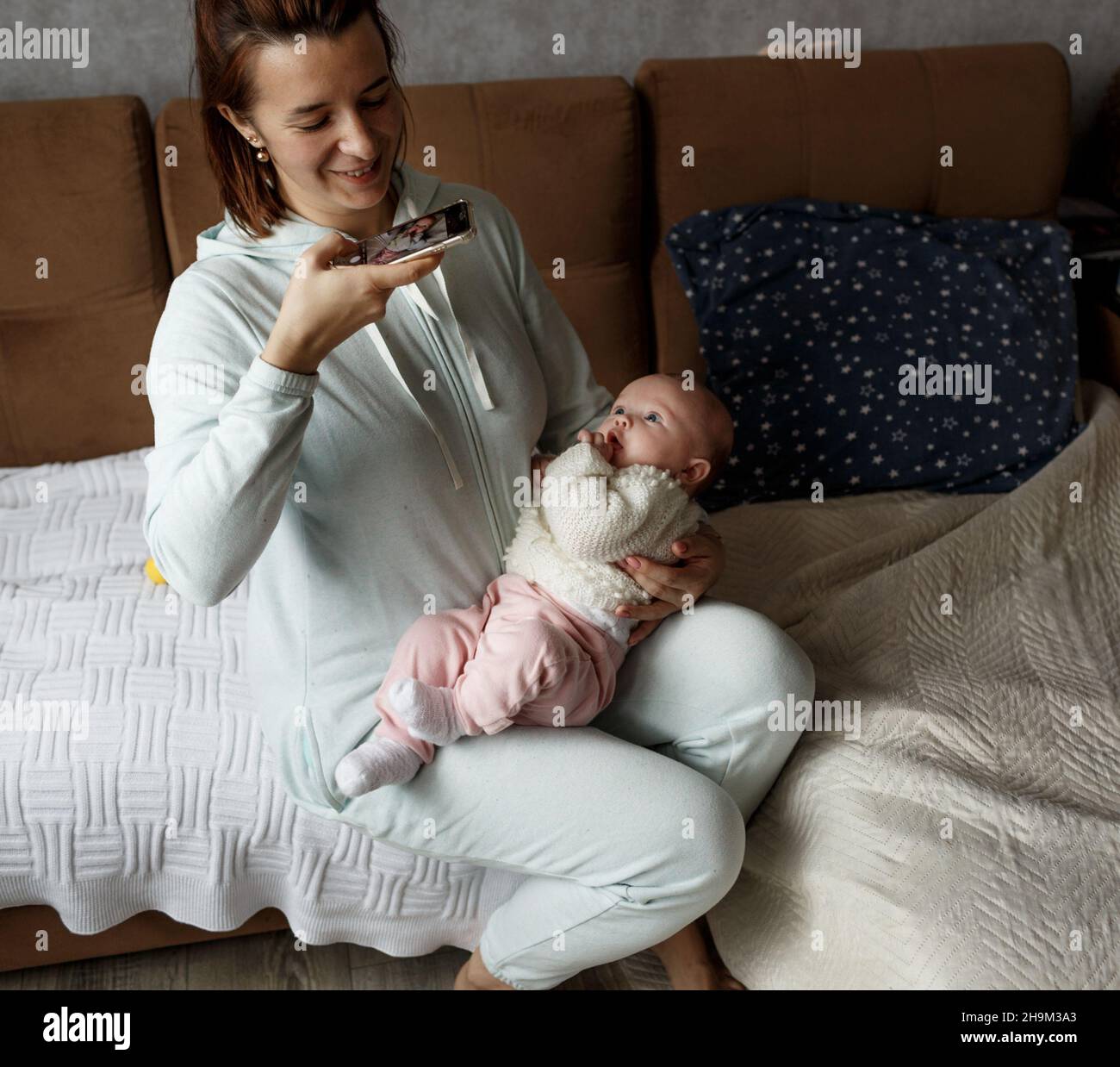 The Concept Of A Family A Happy Young Mother With A Small Child At the-concept-of-a-family-a-happy-young-mother-with-a-small-child-at