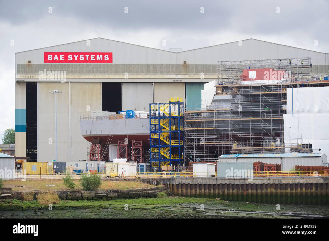 Glasgow, Scotland, UK, August 14th 2020, Shipbuilding and crane in Glasgow on the River Clyde showing ship being built in progress Stock Photo
