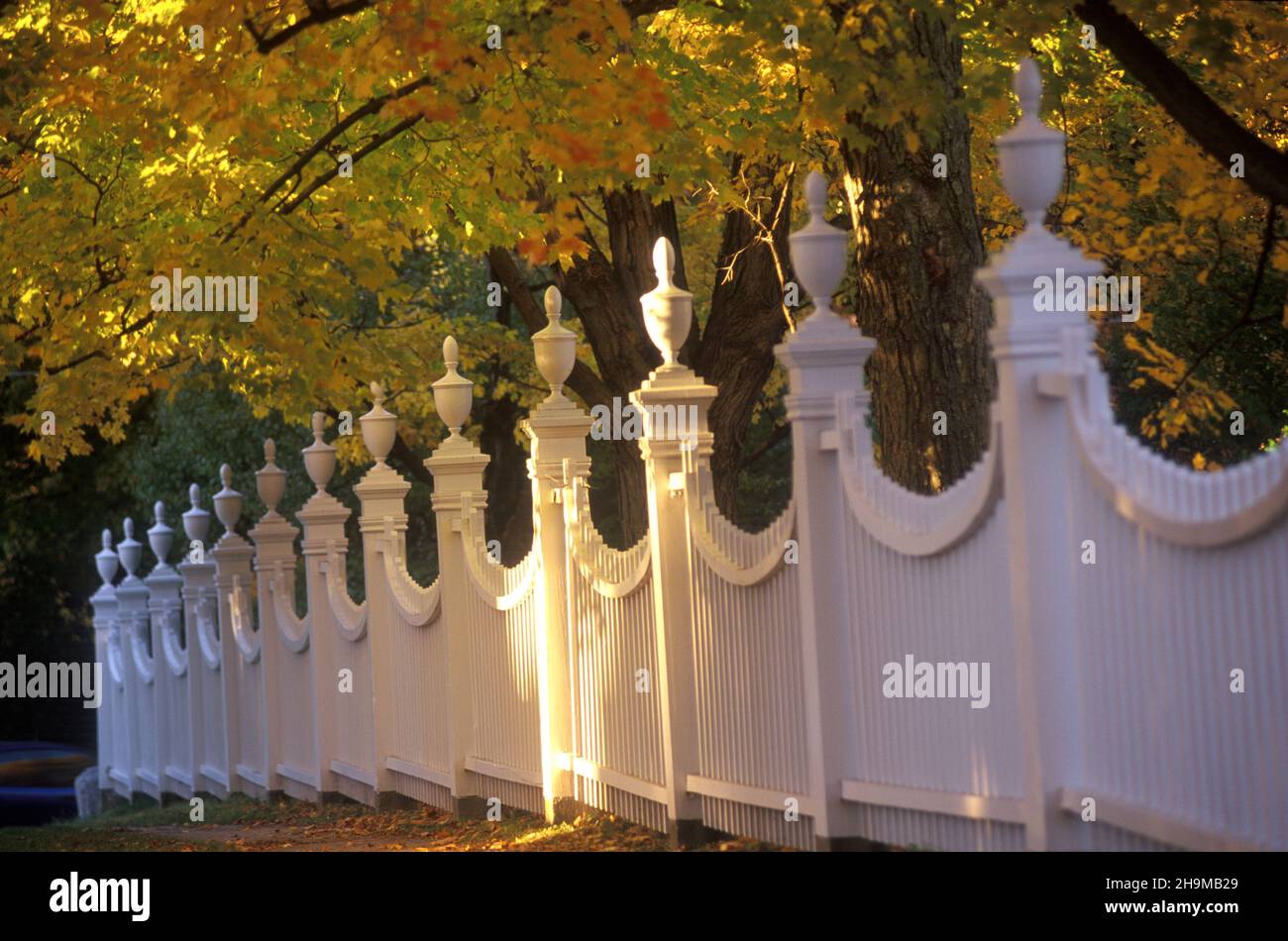 Elaborate White Picket Fence with Fall Foliage, Old First Church, Bennington, Vermont, USA Stock Photo