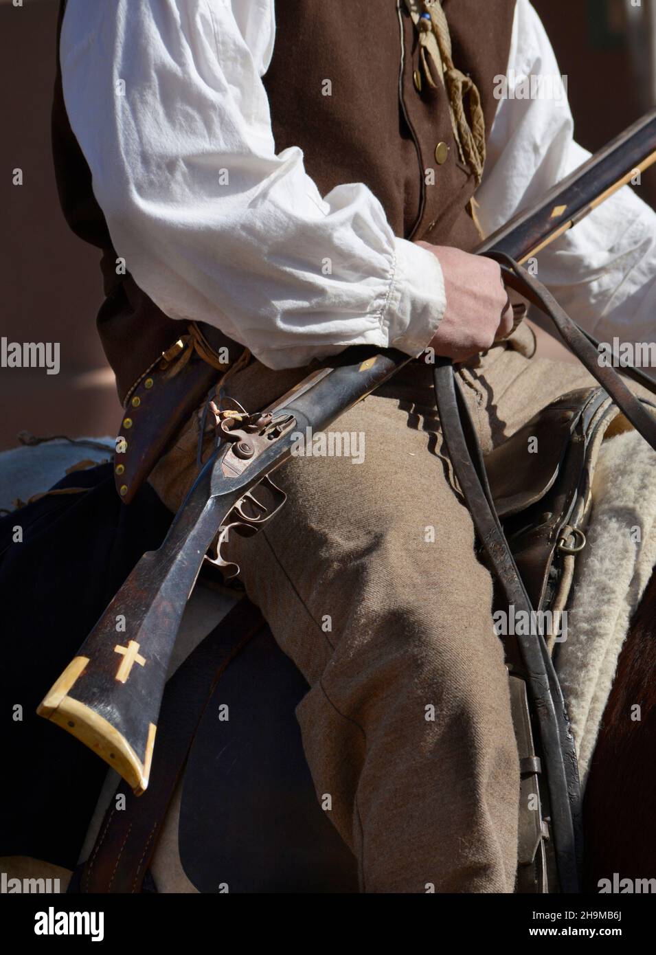Historical reenactors in period dress present a dramatic reenactment of the 1821 opening of the Santa Fe Trail in Santa Fe, New Mexico. Stock Photo