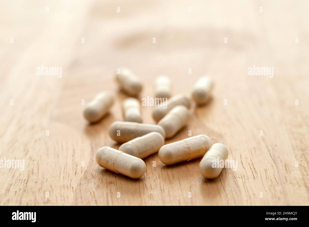 Vitamin supplement capsules - shallow depth of field Stock Photo