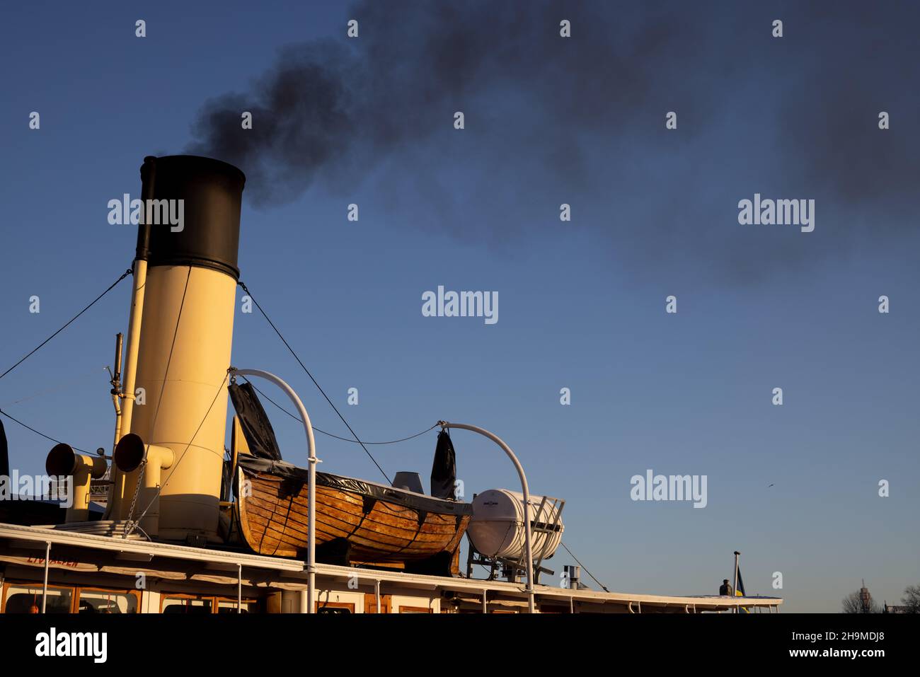 Air pollution in Stockholm. Chimney of boat with black smoke coming out ...