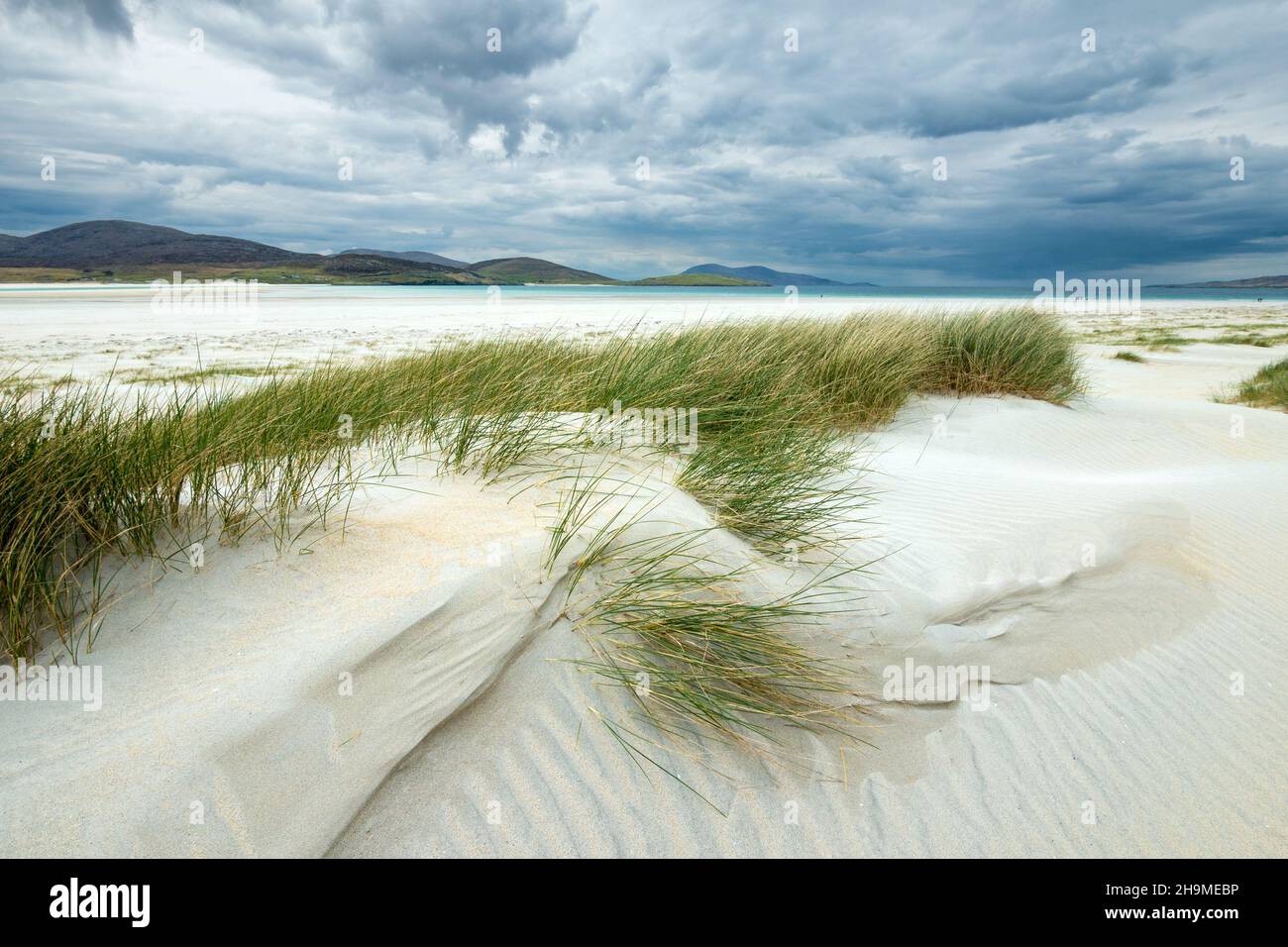 Cloudy skies over marram dune grass and Luskentyre beach on the remote Hebridean Island of Harris in the Outer Hebrides, Scotland, UK Stock Photo