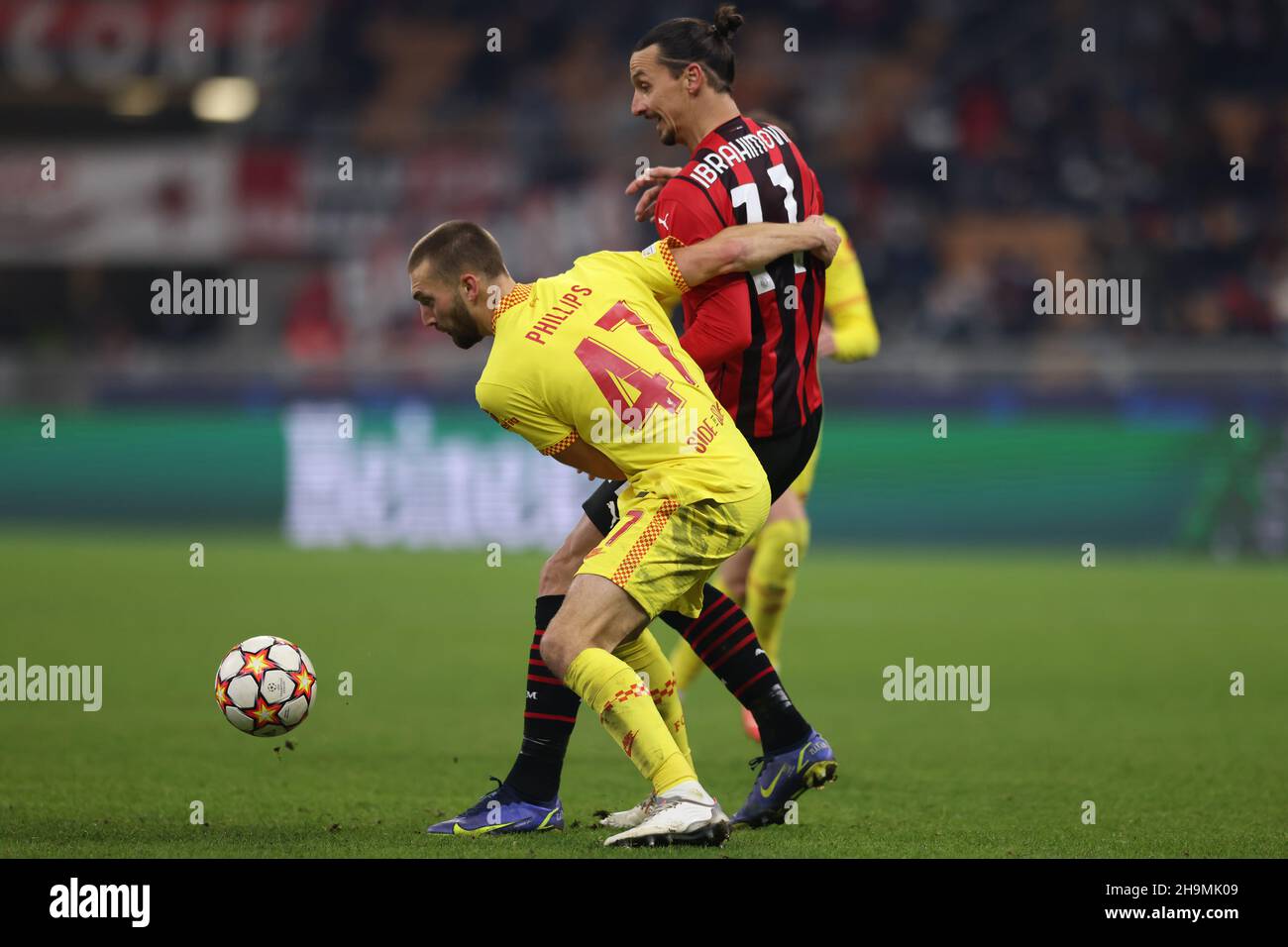 Milan, Italy, 7th December 2021. Nathaniel Phillips of Liverpool tussles with Zlatan Ibrahimovic of AC Milan during the UEFA Champions League match at Giuseppe Meazza, Milan. Picture credit should read: Jonathan Moscrop / Sportimage Credit: Sportimage/Alamy Live News Stock Photo