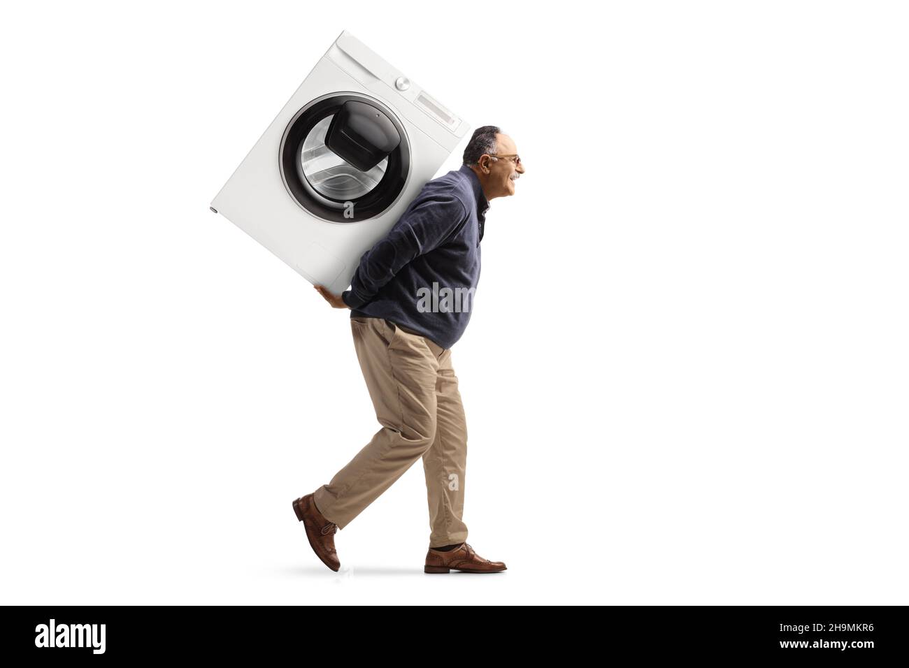 Man carrying washing machine Cut Out Stock Images & Pictures Alamy