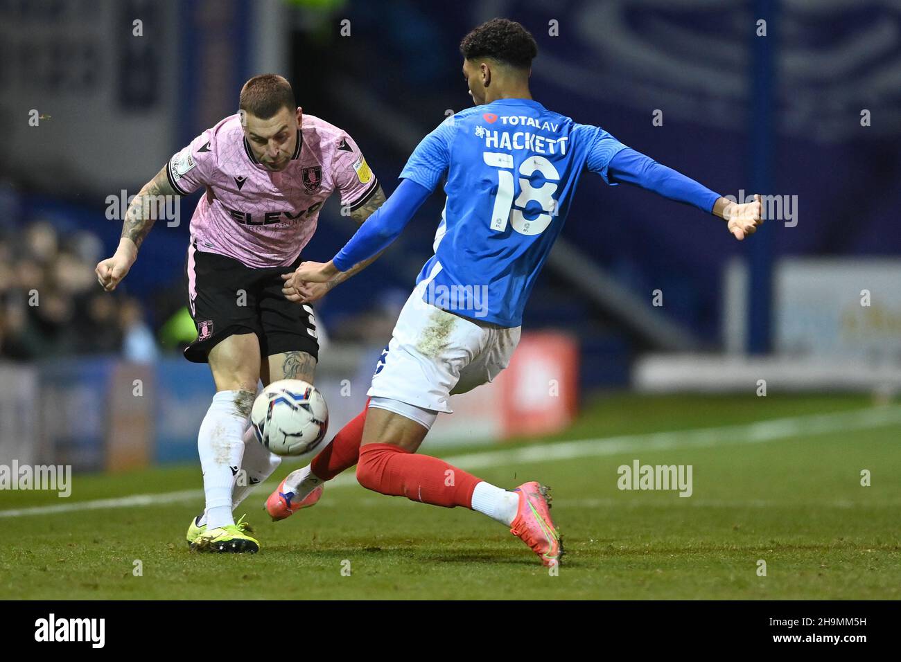 Jack Hunt 32 of Sheffield Wednesday under pressure from Reeco Hackett