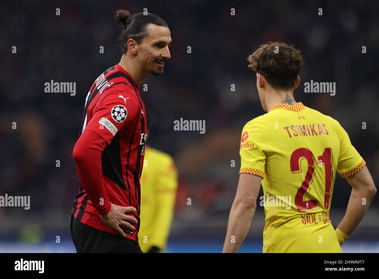 Milan, Italy, 7th December 2021. Zlatan Ibrahimovic of AC Milan and Kostas Tsimikas of Liverpool during the UEFA Champions League match at Giuseppe Meazza, Milan. Picture credit should read: Jonathan Moscrop / Sportimage Credit: Sportimage/Alamy Live News Stock Photo