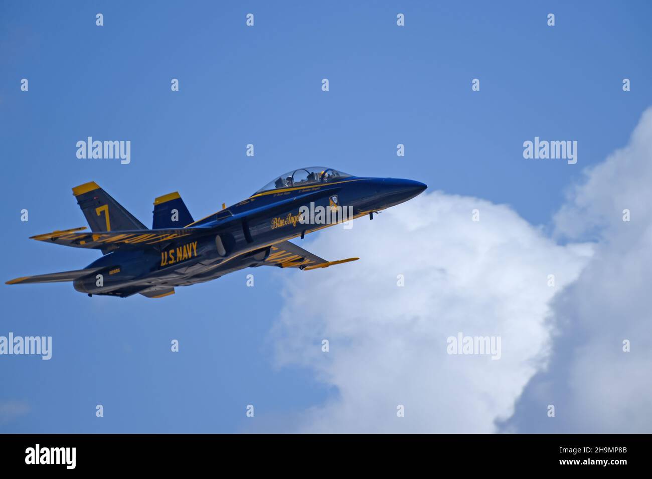 Blue Angel 7 passes crowd line with a lucky passenger Stock Photo