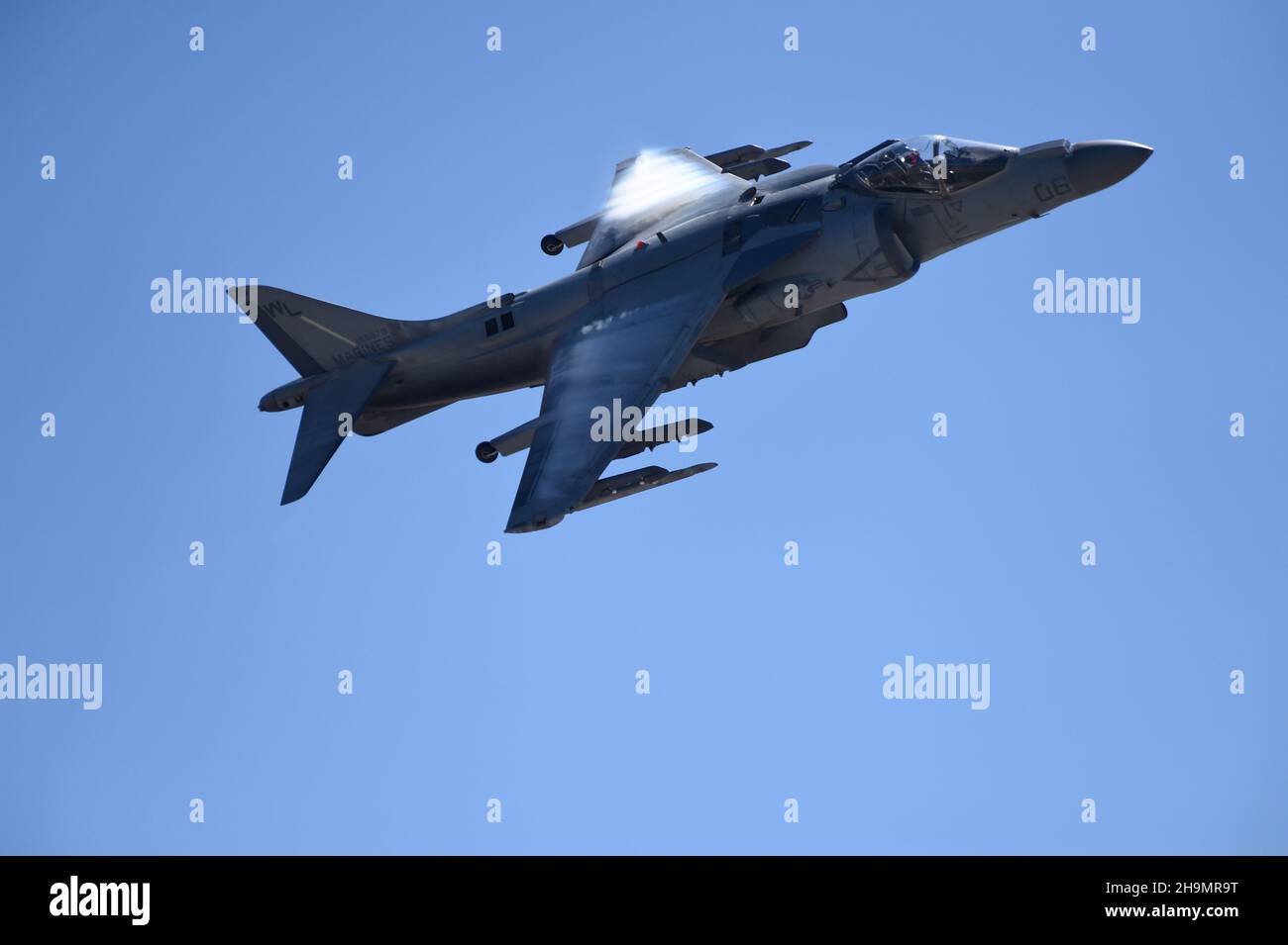 United States Marine Corps AV-8B Harrier makes transonic vapor during a high-speed pass at MCAS Miramar, in San Diego, California Stock Photo