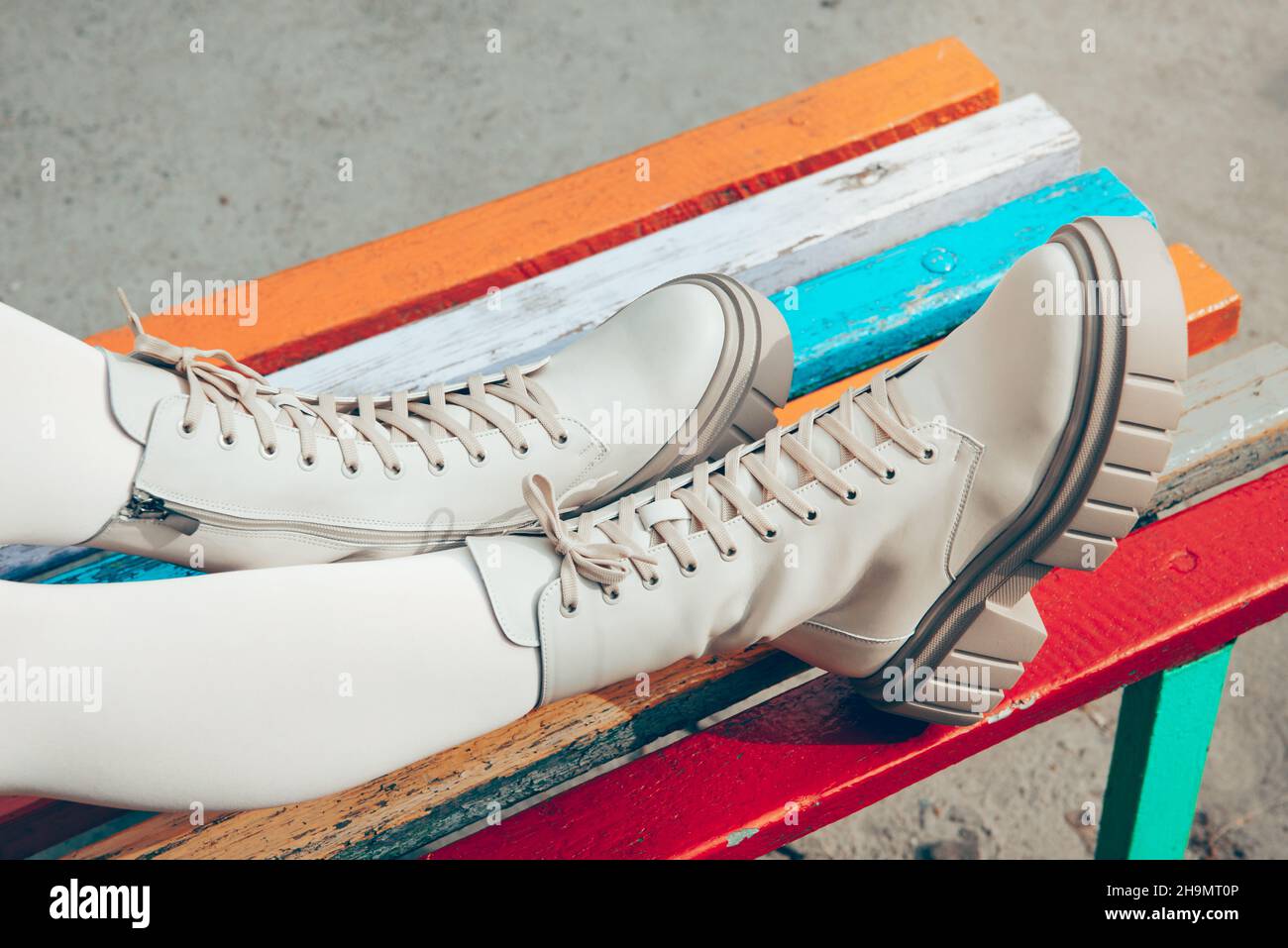 Female legs wearing white fashion boots with laces Stock Photo Alamy