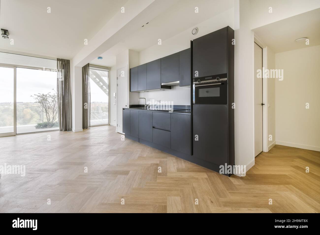 Amazing kitchen with black kitchen unit and stove Stock Photo Alamy