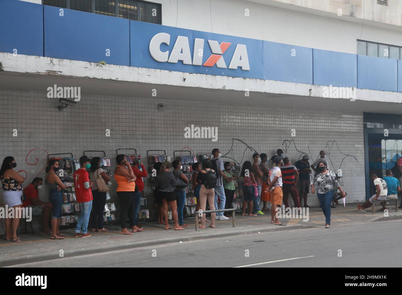salvador, bahia, brazil - december 7, 2021: people are seen queuing for tending at a Caixa Economica Federal branch in the city of Salvador. Stock Photo