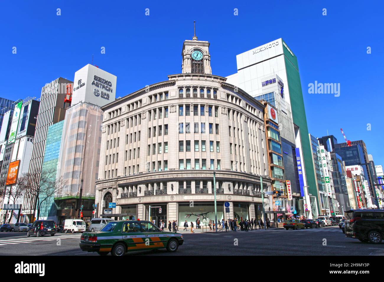 The Wako building which is an exclusive department store in Ginza, Tokyo Japan with it's iconic clock tower on it's roof at the Ginza Crossing. Stock Photo