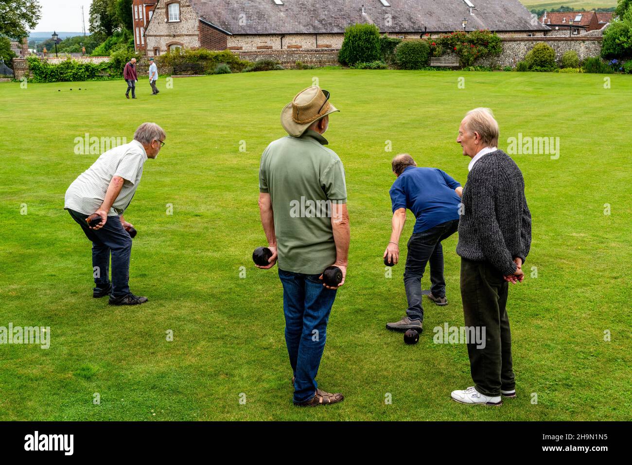 Every Saturday Groups Of Local Men Play A Form Of Bowls Similar To That Played In The 16th Century On The Castle Bowling Green, Lewes, East Sussex, UK Stock Photo