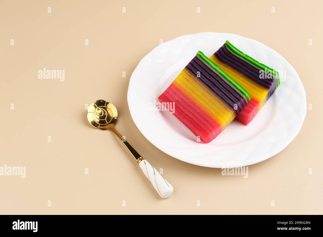 Kue Lapis or Kue Pepe or Rainbow sticky layer cake, Indonesian traditional dessert made from rice flour and coconut milk, steamed layer by layer. Stock Photo