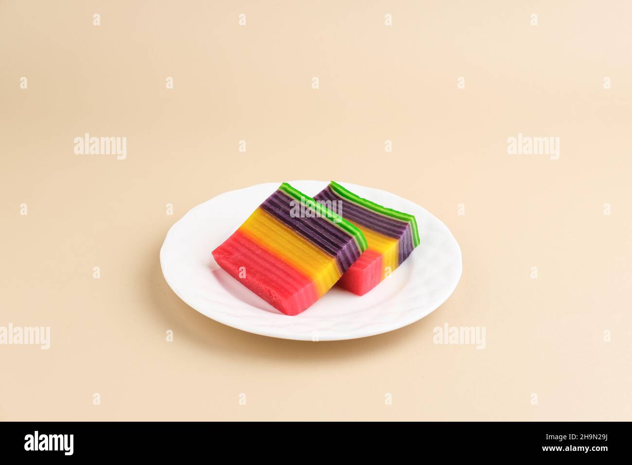 Kue Lapis or Kue Pepe or Rainbow sticky layer cake, Indonesian traditional dessert made from rice flour and coconut milk, steamed layer by layer. Stock Photo